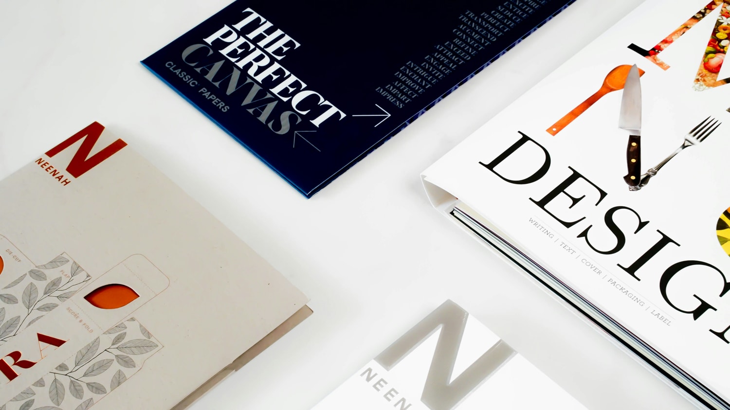 Three books on a white surface showing visible text and design elements, professionally printed by Docuprint in Fremantle, Perth, Australia

